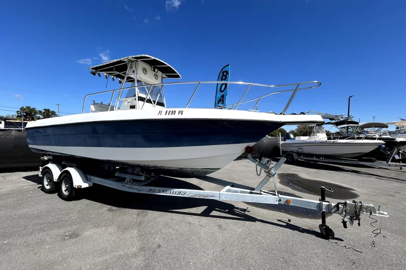 Slide: The Image of 2004 Hydra-Sports Lightning 230 CC boat on trailer, displayed outdoors. - 1