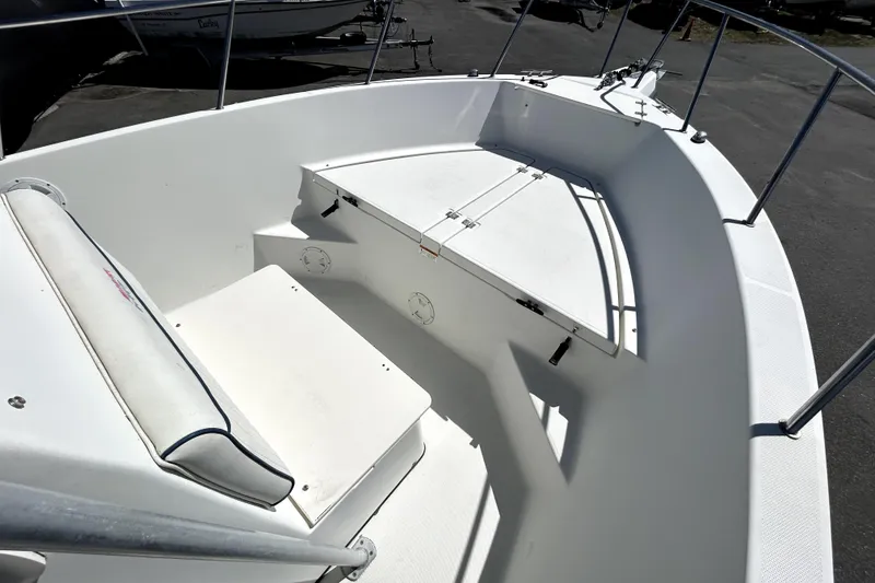 Slide: The Image of 2004 Hydra-Sports Lightning 230 CC boat propeller and trailer in a parking lot. - 11