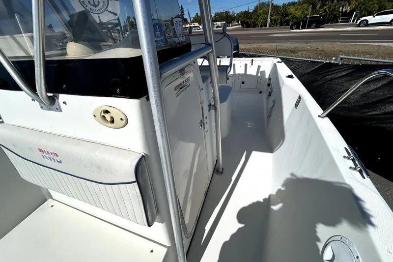 Slide: The Image of 2004 Hydra-Sports Lightning 230 CC boat interior with console and rod holders. - 15