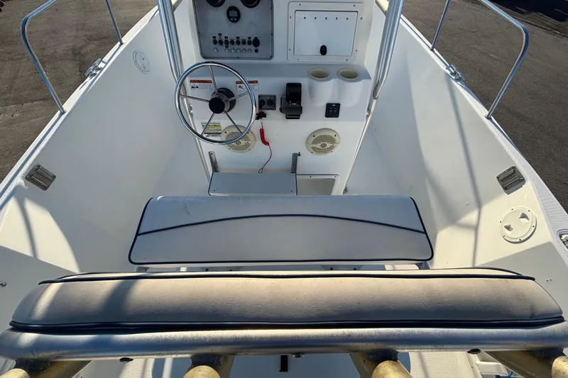 Slide: The Image of 2004 Hydra-Sports Lightning 230 CC boat console with steering wheel and seating. - 19