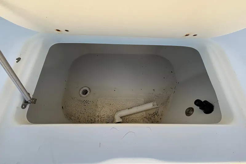 Slide: The Image of Open storage compartment of 2004 Hydra-Sports Lightning 230 CC boat. - 21