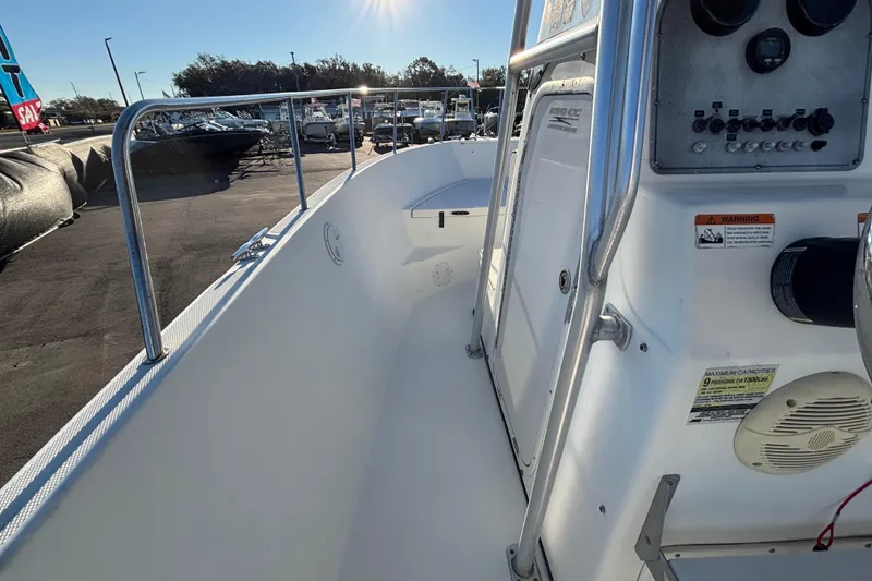 Slide: The Image of 2004 Hydra-Sports Lightning 230 CC boat interior with control panel and railing. - 29