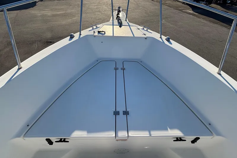 Slide: The Image of 2004 Hydra-Sports Lightning 230 CC boat deck with storage compartments. - 38