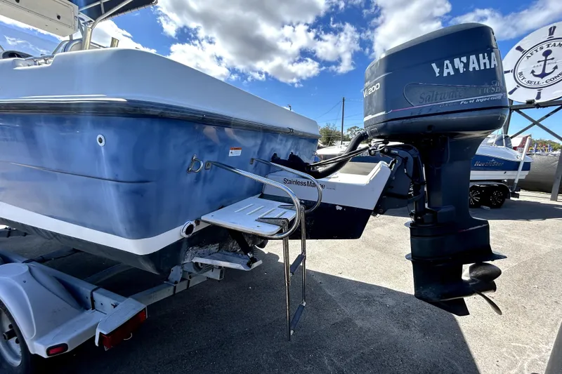 Slide: The Image of 2004 Hydra-Sports Lightning 230 CC boat on trailer, displayed outdoors. - 4