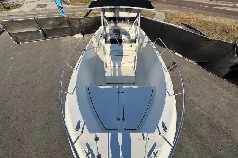 Slide: The Image of 2004 Hydra-Sports Lightning 230 CC boat, top view, docked on pavement. - 48