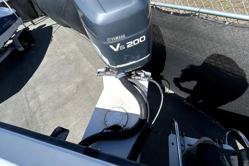 Slide: The Image of 2004 Hydra-Sports Lightning 230 CC boat on trailer, parked outdoors under clear blue sky. - 5