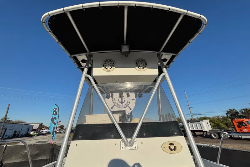 Slide: The Image of 2004 Hydra-Sports Lightning 230 CC boat with T-top and console, viewed from the front. - 51