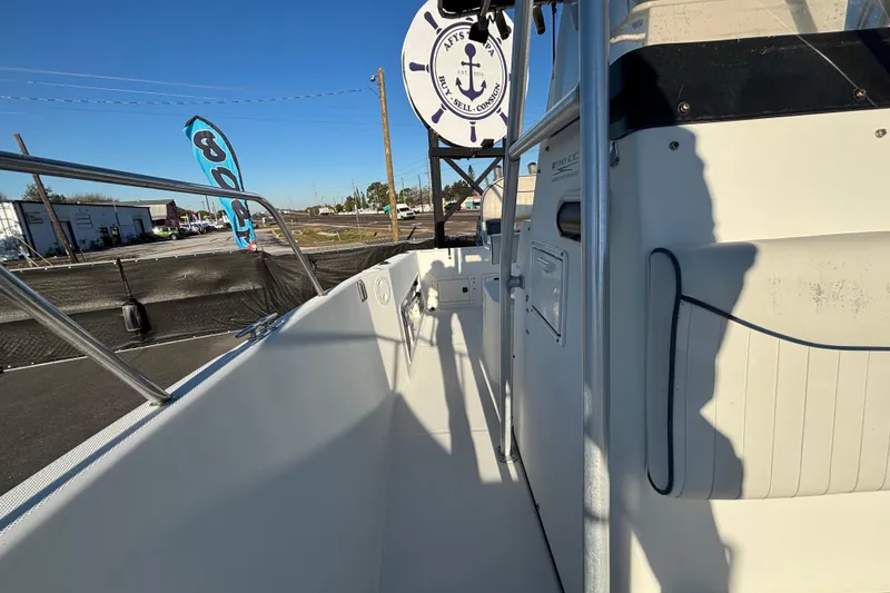 Slide: The Image of 2004 Hydra-Sports Lightning 230 CC boat, docked with clear blue sky background. - 54