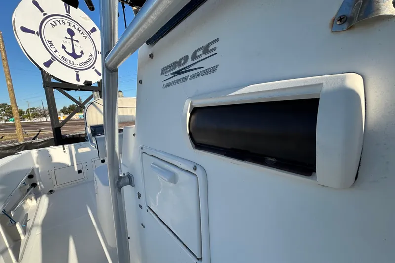 Slide: The Image of 2004 Hydra-Sports Lightning 230 CC boat interior with branding and storage compartments. - 56