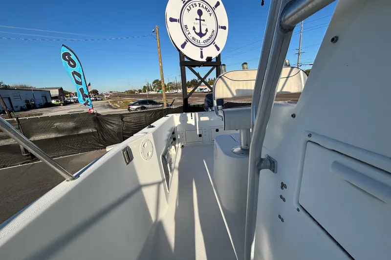 Slide: The Image of 2004 Hydra-Sports Lightning 230 CC boat interior with seating and clear blue sky. - 57