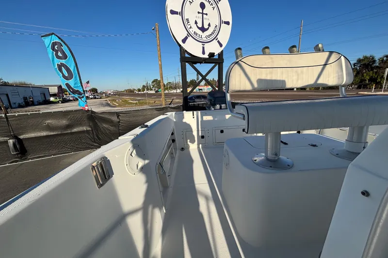 Slide: The Image of 2004 Hydra-Sports Lightning 230 CC boat interior with seating, displayed outdoors. - 58