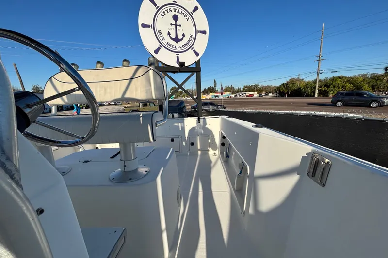 Slide: The Image of 2004 Hydra-Sports Lightning 230 CC boat interior with steering wheel and seating. - 61