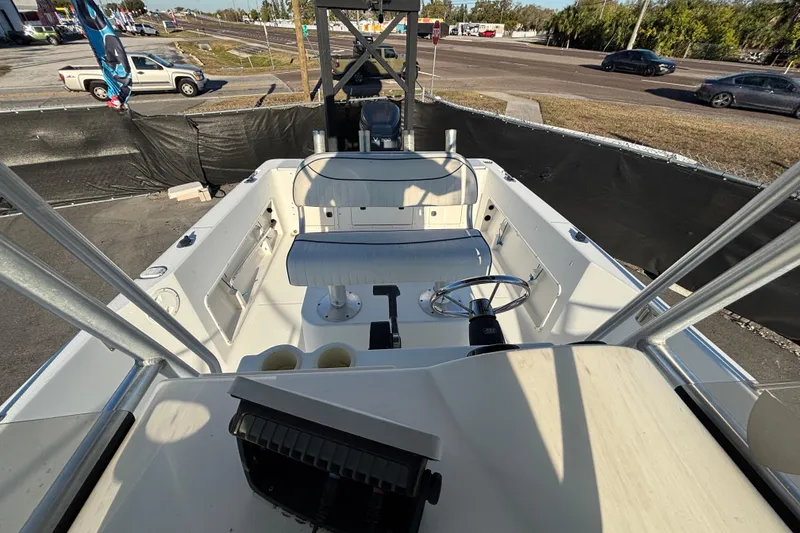 Slide: The Image of 2004 Hydra-Sports Lightning 230 CC boat interior with steering wheel and seating. - 62