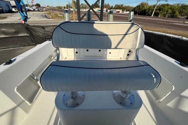 Slide: The Image of 2004 Hydra-Sports Lightning 230 CC boat seating area with white cushioned bench. - 64