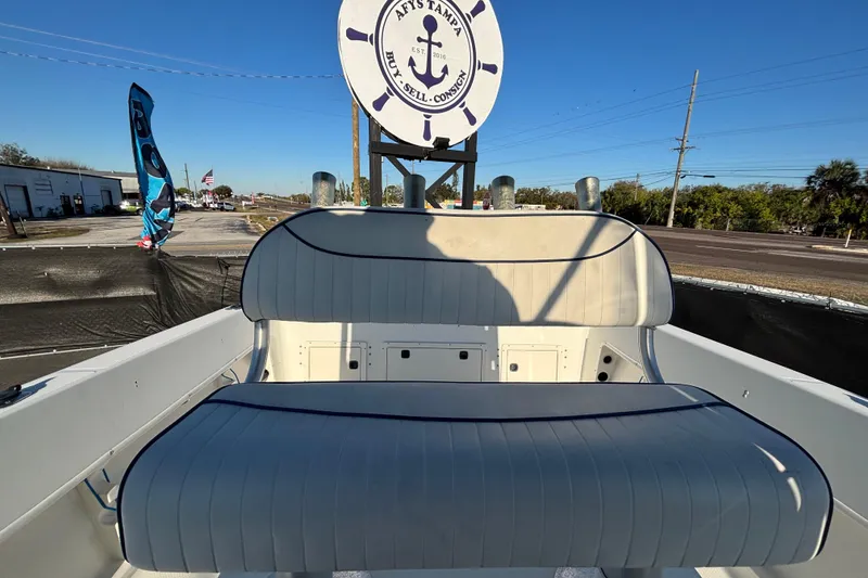 Slide: The Image of 2004 Hydra-Sports Lightning 230 CC boat interior with cushioned seating and nautical decor. - 65