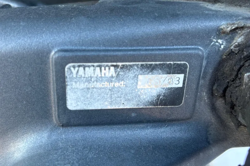Slide: The Image of Close-up of a Yamaha label on a 2004 Hydra-Sports Lightning 230 CC boat. - 68