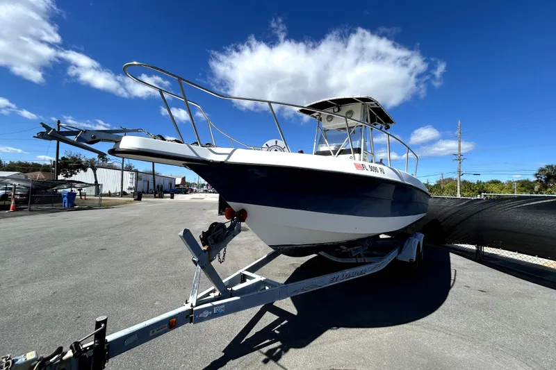Slide: The Image of 2004 Hydra-Sports Lightning 230 CC boat on trailer under clear blue sky. - 7