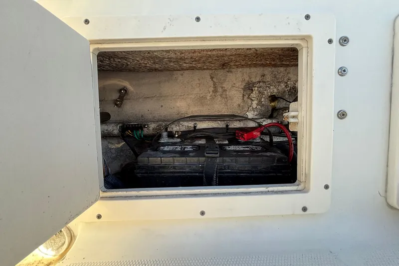 Slide: The Image of Battery compartment of a 2004 Hydra-Sports Lightning 230 CC boat. - 80