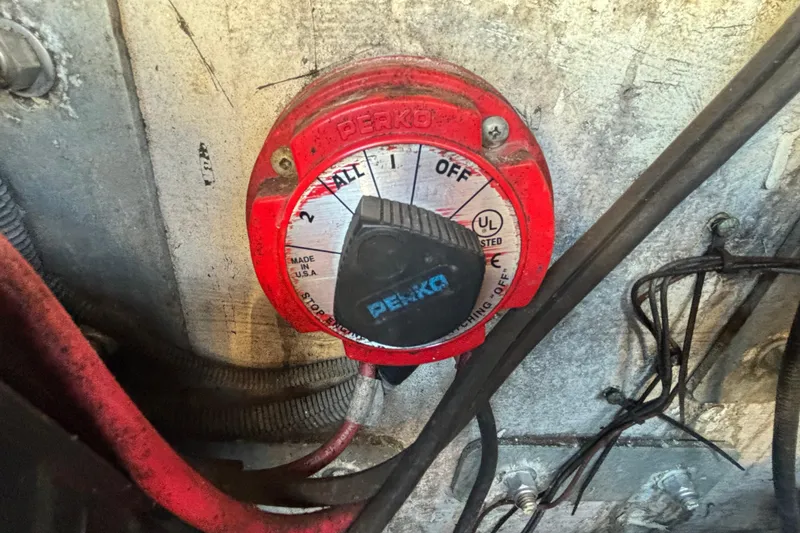 Slide: The Image of Red Perko battery switch on 2004 Hydra-Sports Lightning 230 CC boat. - 82