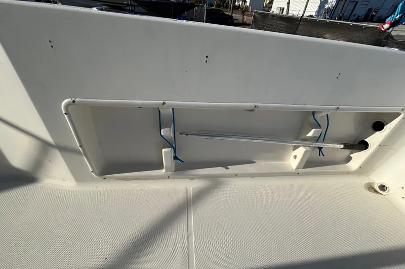 Slide: The Image of 2004 Hydra-Sports Lightning 230 CC boat interior storage compartment. - 86