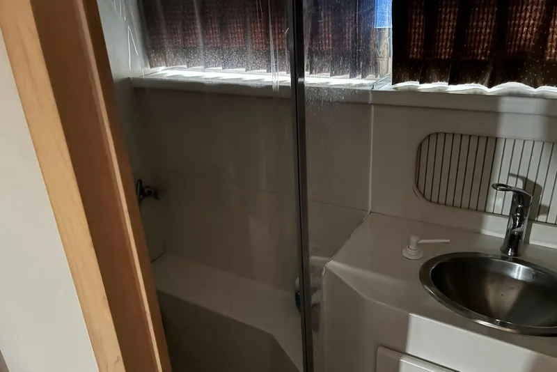 Slide: The Image of Bathroom interior of 1994 Carver 370 Aft Cabin Motor Yacht with sink and shower. - 19