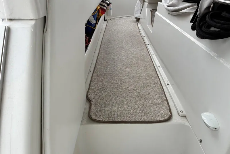 Slide: The Image of Interior walkway of a 1994 Carver 370 Aft Cabin Motor Yacht with carpeted flooring. - 4