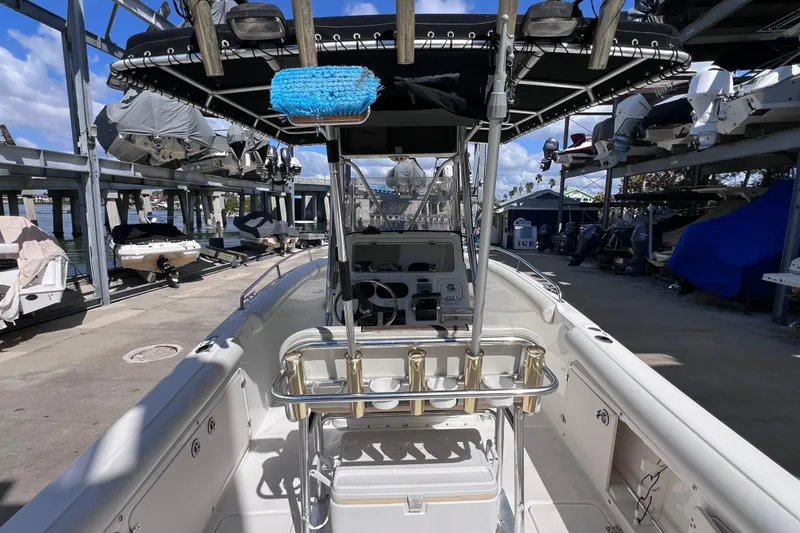 Slide: The Image of 2003 Century 2600 Center Console boat in marina storage, featuring a clean deck and console. - 12