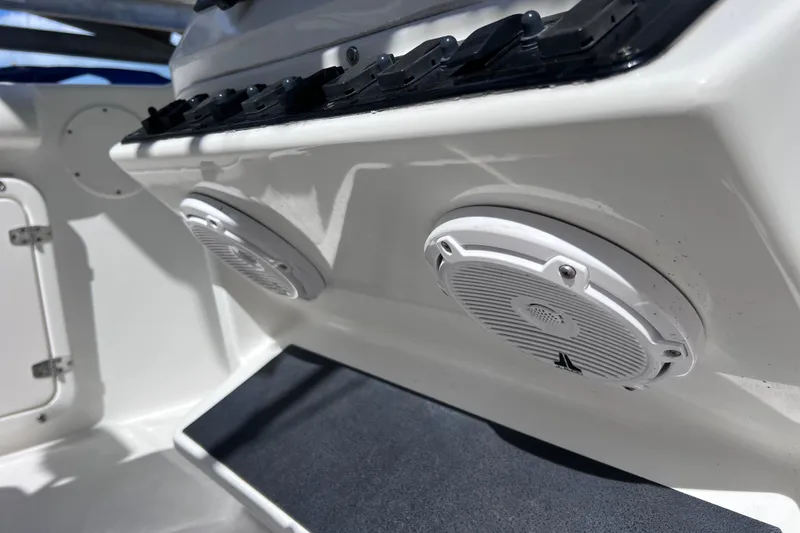 Slide: The Image of 2003 Century 2600 Center Console boat speakers and control panel detail. - 17