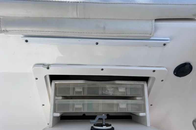 Slide: The Image of Storage compartment on a 2003 Century 2600 Center Console boat. - 21