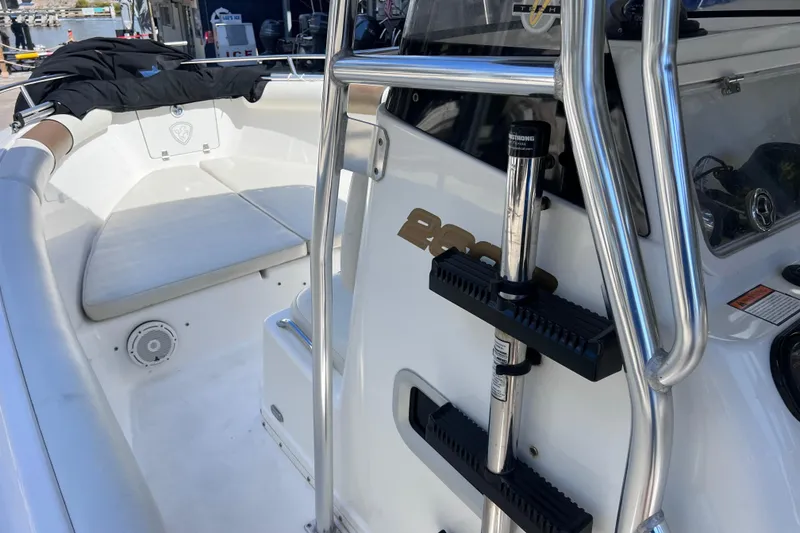 Slide: The Image of 2003 Century 2600 Center Console boat interior with seating and stainless steel railings. - 27