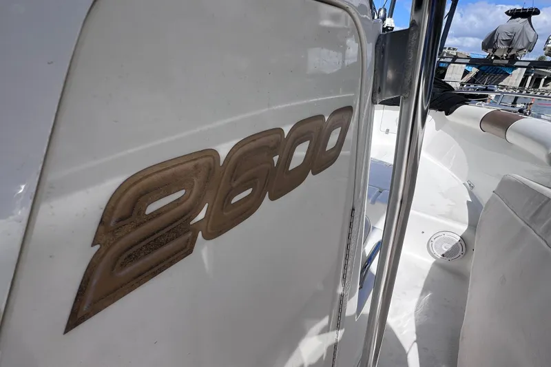 Slide: The Image of 2003 Century 2600 Center Console boat interior with logo detail. - 33