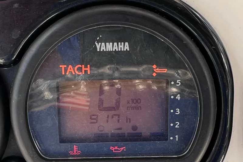 Slide: The Image of Yamaha tachometer displaying 917 hours on a 2003 Century 2600 Center Console boat. - 37