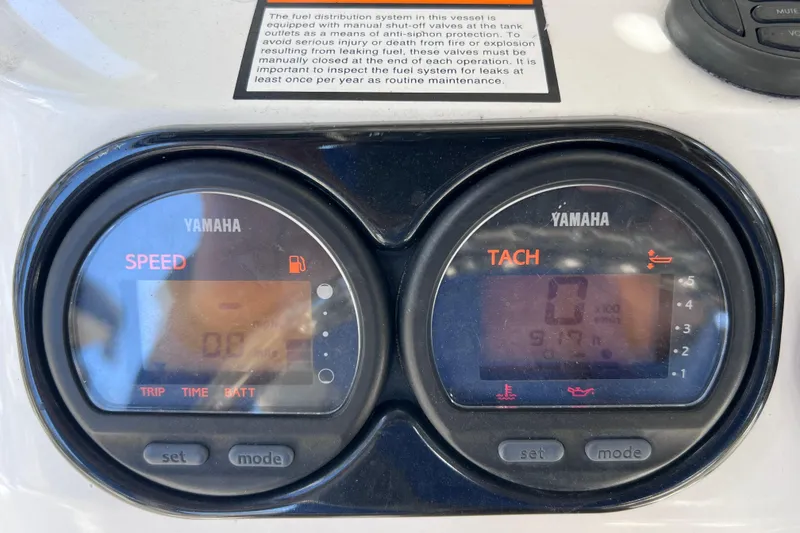 Slide: The Image of Yamaha speed and tachometer gauges on 2003 Century 2600 Center Console boat dashboard. - 38