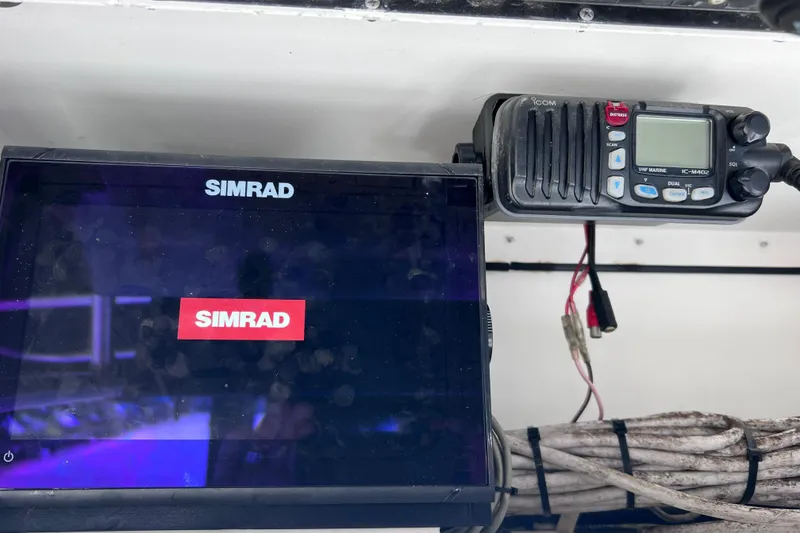 Slide: The Image of Simrad marine electronics and Icom VHF radio on 2003 Century 2600 Center Console boat. - 39