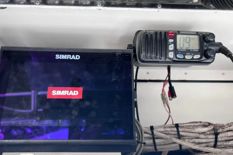 Slide: The Image of Simrad marine electronics on a 2003 Century 2600 Center Console boat dashboard. - 40