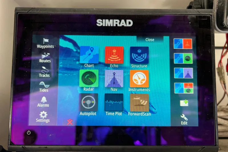 Slide: The Image of Simrad marine navigation display on a 2003 Century 2600 Center Console boat. - 42