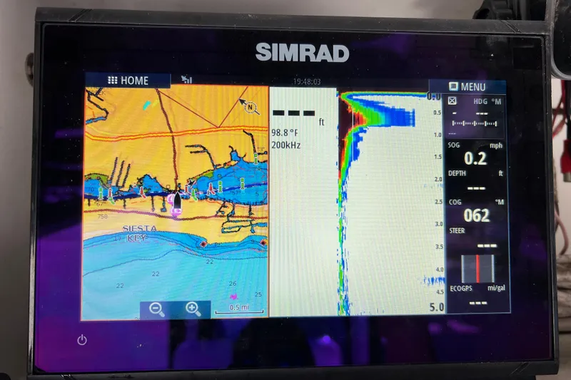 Slide: The Image of Simrad marine GPS display showing Siesta Key map and sonar data on a Century 2600 Center Console. - 43
