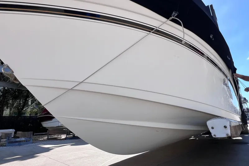 Slide: The Image of 2003 Century 2600 Center Console boat on trailer, side view. - 6