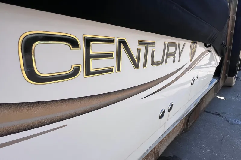 Slide: The Image of 2003 Century 2600 Center Console boat with bold logo and sleek design. - 8