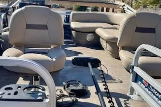 Slide: The Image of 2023 Sun Tracker Bass Buggy 16 XL Select pontoon boat interior with seating and equipment. - 10