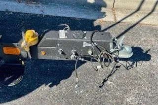 Slide: The Image of Trailer hitch of 2023 Sun Tracker Bass Buggy 16 XL Select on pavement. - 12