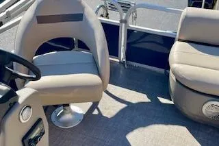 Slide: The Image of 2023 Sun Tracker Bass Buggy 16 XL Select interior with seating and steering wheel. - 7