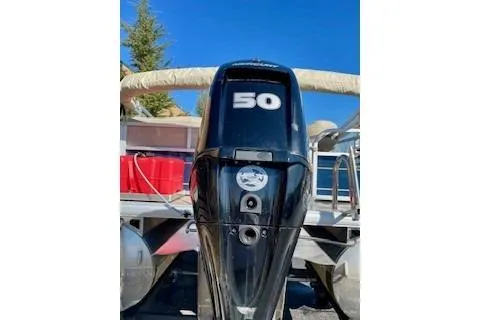 Slide: The Image of 2023 Sun Tracker Bass Buggy 16 XL Select with 50 HP engine, rear view. - 8