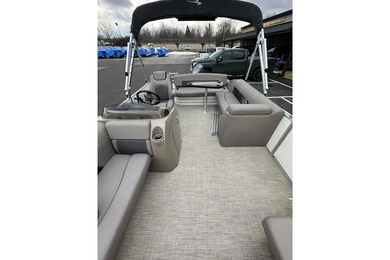 Slide: The Image of 2019 Bennington SX 22 SSBXP pontoon boat interior with seating and steering console. - 11
