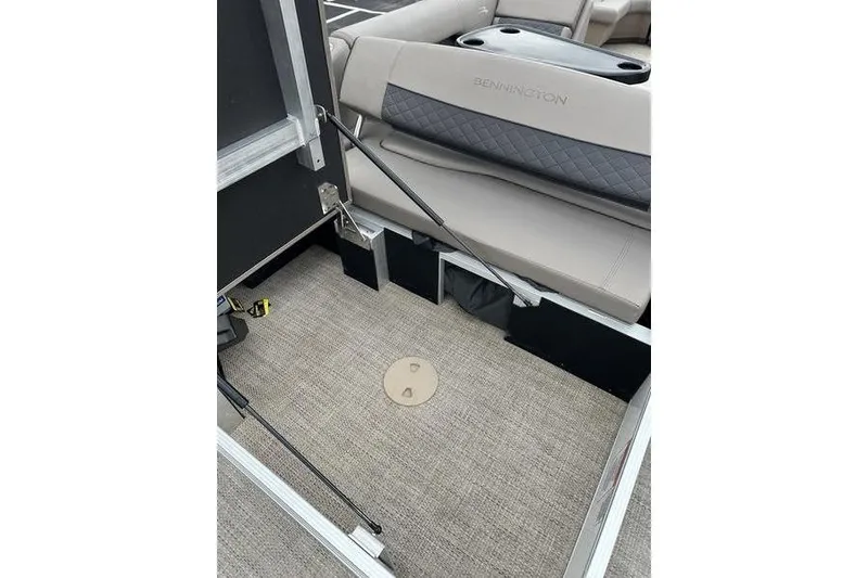 Slide: The Image of 2019 Bennington SX 22 SSBXP boat interior with beige seating and carpeted floor. - 14