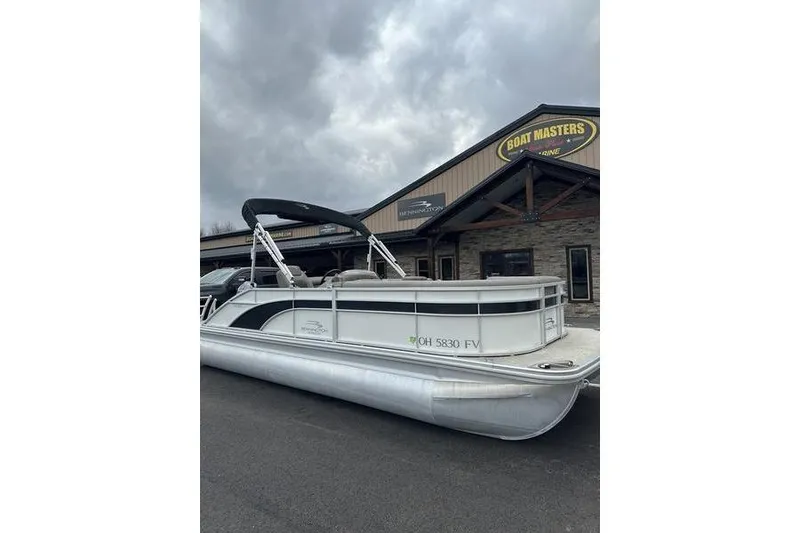 Slide: The Image of 2019 Bennington SX 22 SSBXP pontoon boat parked outside Boat Masters Marine. - 2