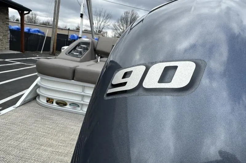 Slide: The Image of 2019 Bennington SX 22 SSBXP pontoon boat with 90 HP engine, outdoor setting. - 3