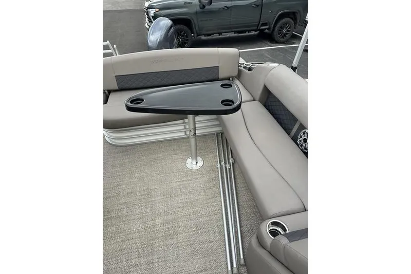 Slide: The Image of 2019 Bennington SX 22 SSBXP pontoon boat interior with seating and table. - 4