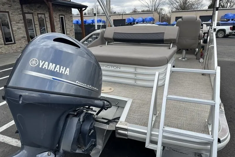 Slide: The Image of 2019 Bennington SX 22 SSBXP pontoon boat with Yamaha outboard motor in parking lot. - 6