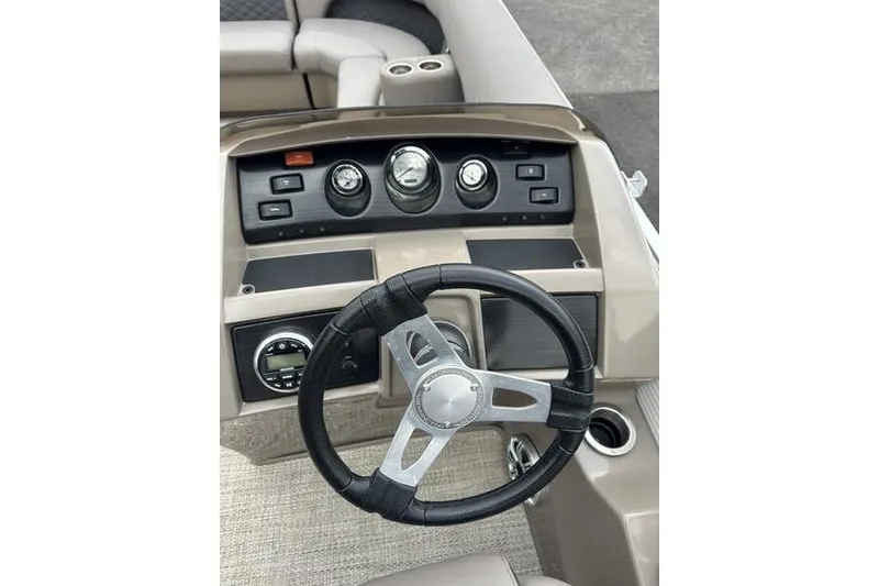 Slide: The Image of 2019 Bennington SX 22 SSBXP boat dashboard with steering wheel and gauges. - 9